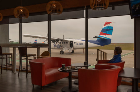Lands End Airport, St Just, Cornwall, England. UK. Passenger in cafe having had flight cancelled due to bad weather.のeditorial素材
