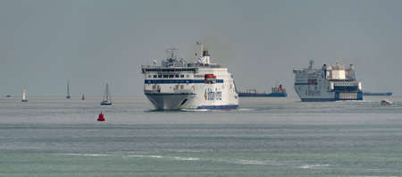Portsmouth, England, UK. 2022. RORO cross channel car ferries pass on The Solent, close to Portsmouth Harbour entrance.の写真素材
