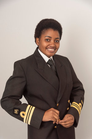 England United Kingdom. 25.01. 2025.  Female  officxer wearing insignia of a Lieutenant Commander South African Navy. Buttoning uniform jacket.の写真素材