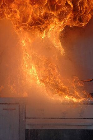 flames from adding water to burning oil on a kitchen stove # 2のeditorial素材