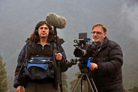 Cameraman and sound recordist at work on the West Coast, New Zealand