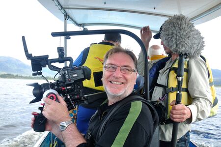 Cameraman and sound recordist at work on the lake