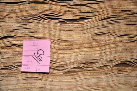 stack of veneer ready for processing at a plywood factoryの写真素材