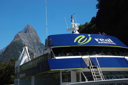 MILFORD SOUND, NEW ZEALAND, JANUARY 8: Visitors enjoy the sights from a tourist launch on 8-1-2011 at Milford Sound in New Zealand. Milford Sound is one of the country's  favourite tourist destinations. のeditorial素材