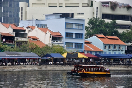 SINGAPORE, FEBRUARY 13: A ferry carries passengers through a retail district on February 13, 2009 in Singapore cityのeditorial素材