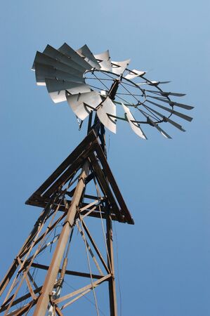 Windmill on the Darling Downs, Queensland, Australia. Windmills are commonly used for pumping water from bores or dams to troughs for livestock.の写真素材