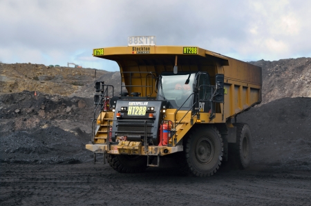 WESTPORT, NEW ZEALAND, JULY 12, 2013  A 70 ton truck waits for a load of coal at Stockton open cast coal mine on July 12, 2013 near Westport, New Zealand  Stockton is the countryのeditorial素材