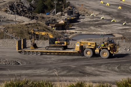 WESTPORT, NEW ZEALAND, AUGUST 31, 2013  a 40 ton digger hitches a ride on a huge custom-built...