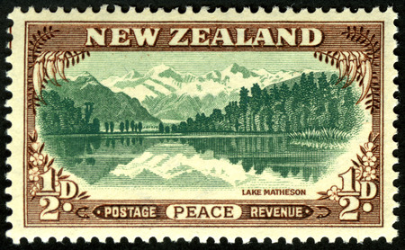 1946 New Zealand half penny peace stamp featuring Lake Matheson, Westland, New Zealandのeditorial素材