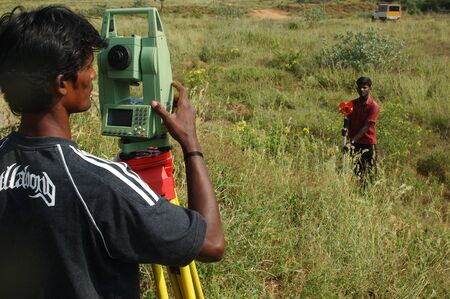 TAMIL NADU, INDIA, circa 2009: Men surveying land in Tamil Nadu, Indiaのeditorial素材