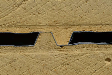 Background of plastic foam cladding on a building site. sandwiched between layers of colour steel, the foam plastic creates excellent insulation.の写真素材