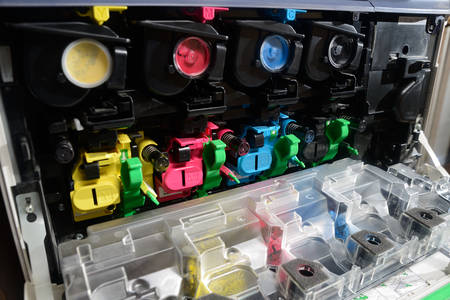 toner cartridges lined up inside the front panel of a photocopierの写真素材