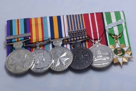KINGAROY, AUSTRALIA, MARCH 29, 2016: Anzac Day medals mounted on a bar for a returned serviceman in Australiaのeditorial素材
