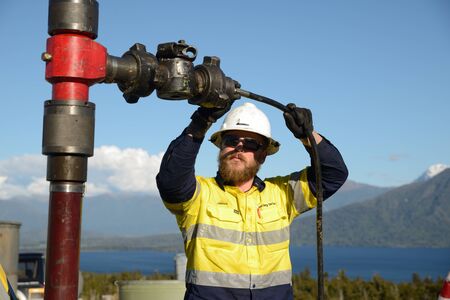 MOANA, NEW ZEALAND, OCTOBER 27, 2017: An unidentified engineer prepares to make a pressure test on...