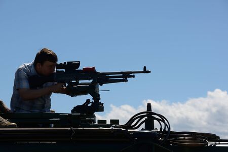GREYMOUTH, NEW ZEALAND, NOVEMBER 18, 2017: An unidentified schoolboy lines up a Mag 58 GM machine...