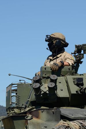 GREYMOUTH, NEW ZEALAND, NOVEMBER 18, 2017: The crew of a Light Armoured Vehicle (LAV) prepares to depart from at an open day for the military.のeditorial素材