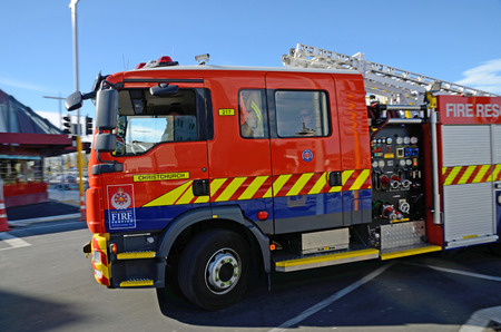 CHRISTCHURCH, NEW ZEALAND, APRIL 20, 2018: A fire rescue truck rushes to its next job in the central business district. Slight blur in background from panning.のeditorial素材