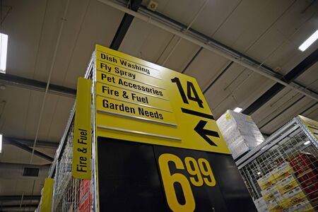 NELSON, NEW ZEALAND, JULY 19, 2018: Bold signage directs customers to examine sale goods in a...