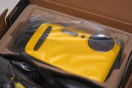 A new waterproof camera rests in its box with original packaging