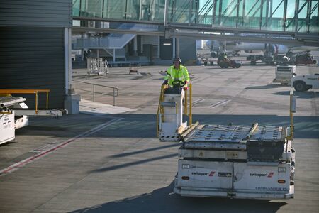 BRISBANE, AUSTRALIA, JULY 27, 2019: An unidentified luggage handler at Brisbane International...