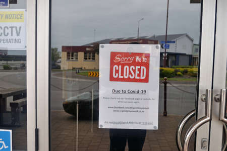 GREYMOUTH, NEW ZEALAND, APRIL 11, 2020: Signage on a closed business during the Covid 19 lockdown in New Zealand, April 11,  2020のeditorial素材