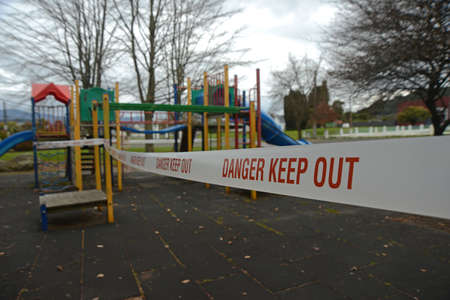REEFTON, NEW ZEALAND, SEPTEMBER 6, 2021: Signage and barriers warn children away from a public...