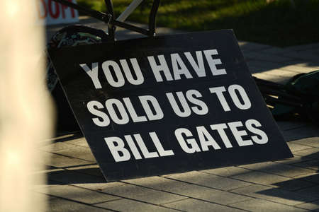 CHRISTCHURCH, NEW ZEALAND, JULY 24, 2021; Detail of a placard at a protest rally at the Bridge of Remembrance in  Christchurch. Activists spoke against increasing government control over Covid vaccinations, farm taxes and civil liberties.のeditorial素材