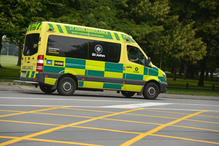 CHRISTCHURCH, NEW ZEALAND, DECEMBER 30, 2020; A yellow and green St John ambulance on its way to Christchurch hospital, December 30, 2020のeditorial素材