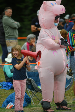 ARTHURS PASS, NEW ZEALAND, FEBRUARY 12, 2022; colourful spectators at Klondike Corner watch the start of the 115km cycling section of the Coast to Coast Triathlonのeditorial素材