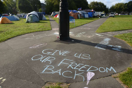 Christchurch, New Zealand, February 22, 2021: Sidewalk graffiti at the Cranmer Square mandate protest in Christchurch. Activists pitched tents and occupied the square peacefully for several weeks.のeditorial素材