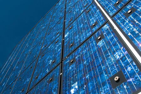 Solar panels on a building against blue sky