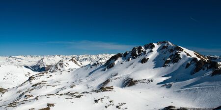 snow covered mountains in swiss alpsの写真素材