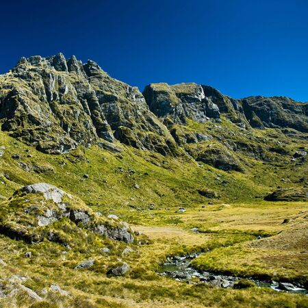 green valley on routebourn track, south island, new zealand.の写真素材
