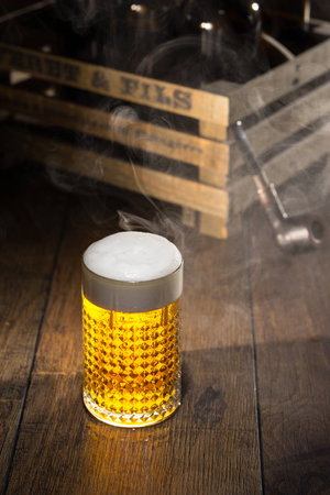 Shiny glass of beerの写真素材
