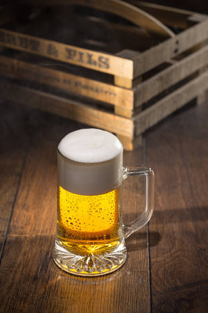 Shiny glass of beerの写真素材