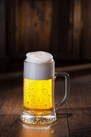Shiny glass of beerの写真素材