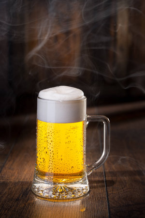 Shiny glass of beerの写真素材