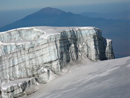 View from glacier of  Mt. Kilimanjaro, the roof of Africa, the highest mountain of Africa. In the background Mt. Montemero near towm Arusha.の写真素材