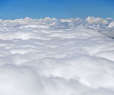 Above clouds and mountains. View from mountain Kazber, Russia.