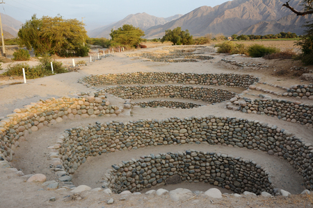 Wells constructions and part of elaborate underground aqueduct system made by the people of Nazca at 400500 AD, Nazca Desert in southern Peru.のeditorial素材