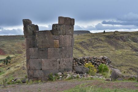 Sillustani tombs in the peruvian Andes near town Puno, Peru.An inca burial tower at the Sillustani archaeological site near town Puno, Peru.の写真素材