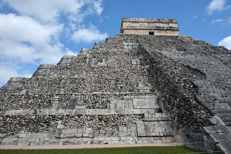 Temple of Kukulkan, pyramid in Chichen Itza, Yucatan, Mexico. The Temple of Kukulkan usually named as El Castillo. This step pyramid is about 30 metres high and consists of a series of 9 square terraces, each approximately 2.57 metres high, with a 6-metreの写真素材