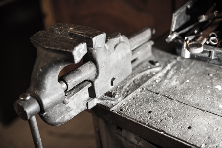 Iron Vice in Workshop. Workshop Desk with Vice Closeup.の写真素材