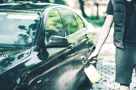 Spraying Car Body Wax. Car Waxing Closeup.の写真素材