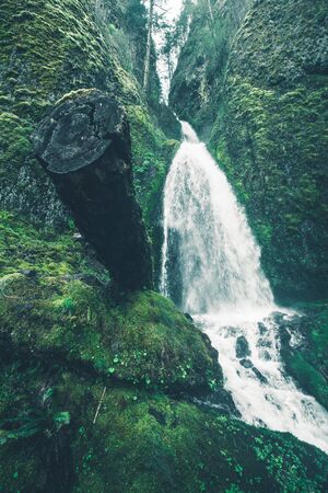 Spring in Oregon. Scenic Waterfall and Mossy Rocks. Oregon, USAの写真素材