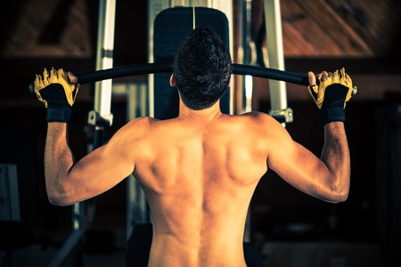 Young Caucasian Men in the Home Gym During Workout.
