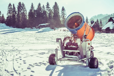 Snow Making Gun on the Ski Slope. Winter Skiing Slope Equipment.の写真素材