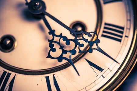 Vintage clock hands closeup photo.の写真素材