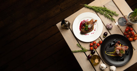 Exquisite Italian cuisine in a restaurant on a black background.の写真素材