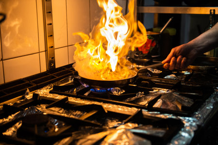 Cooking with fire in the restaurant kitchen.